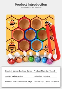 Macro view of wooden bee hive toy with colorful bees and red tweezers for fine motor skills