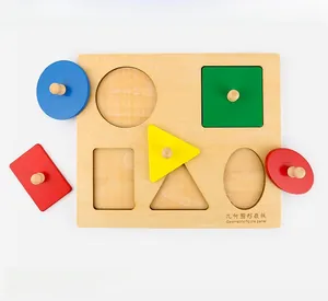 Close-up of wooden Montessori puzzle with 5 colorful geometric shapes and easy-grip knobs