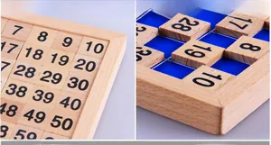 Detail of wooden 1-100 number board with smooth pine pieces and blue grid tray