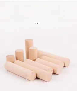 Close-up of polished solid wooden cylinders with beveled edges for educational puzzles
