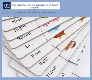 Close-up of thick cardboard digital matching cards with animal illustrations and numbers