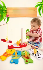 Macro shot of colorful numbered wooden fish and magnetic rod for toddler motor skills