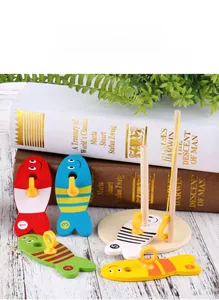 Detailed view of wooden magnetic fishing toy set with numbered fish and stacking peg base