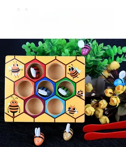 Close-up of Montessori wooden beehive toy with colorful bees and red tweezers set