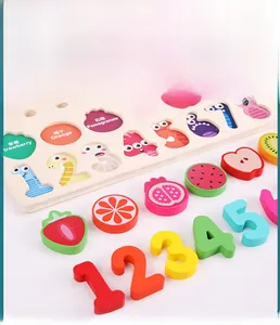 Macro shot of colorful wooden number and fruit blocks on a puzzle board for toddlers