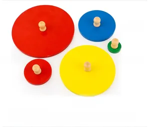 Macro shot of 5 colorful wooden shape sorting blocks with easy-grip knobs for toddlers