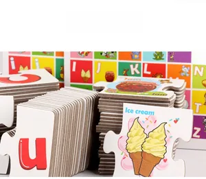 Close-up of thick puzzle cards showing alphabet letters and vibrant illustrations