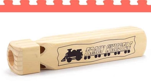 Detailed view of natural wooden train whistle showing steam engine print and texture