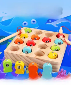 Detail of wooden magnetic fishing toy with 15 colorful numbered fish and two rods