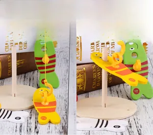 Close-up of wooden magnetic fishing toy with numbered colorful fish and wood stand