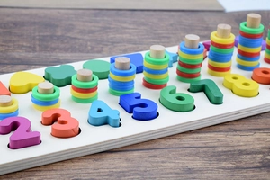 Detail of wooden Montessori toy with colorful numbers and counting rings on a base