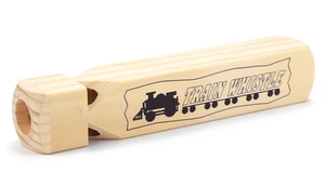 Macro shot of natural wood train whistle with TRAIN WHISTLE print and dual air holes