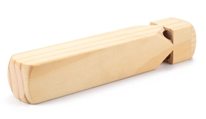 Macro detail of natural pine wood train whistle showing smooth texture and side sound holes