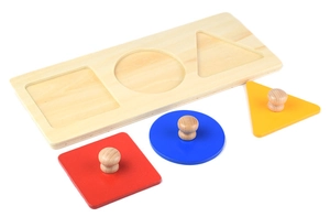 Macro detail of wooden Montessori puzzle with colorful geometric shapes and small handles