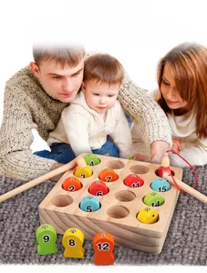 Macro detail of magnetic wooden fish with numbers for educational fishing game set