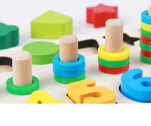 Close-up of wooden Montessori toy showing colorful numbers and stacking rings on pegboard