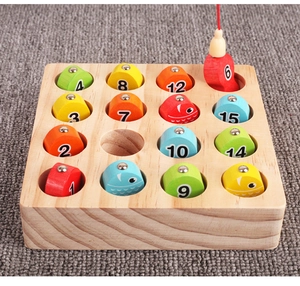 Macro detail of magnetic wooden fishing toy showing numbered fish being caught by rod