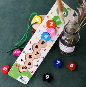 Detail of wooden caterpillar puzzle blocks with numbered pieces and threading string