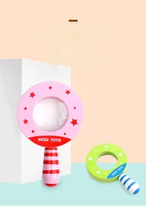 Detail of colorful wooden magnifying glasses for children showing pink and green designs