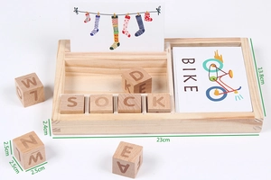 Detail of wooden alphabet blocks and word cards on a 23cm base for early English learning
