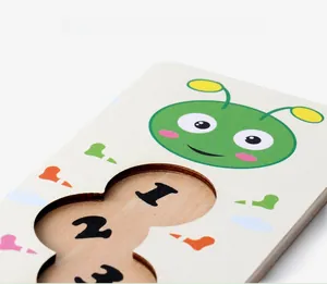 Detailed top view of wooden caterpillar puzzle with colorful number slots 1, 2, and 3