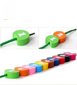 Macro detail of colorful wooden number blocks and threading string for toddler learning