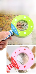 Close-up of wooden magnifying glass toy showing vibrant colors and real magnification
