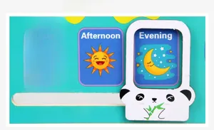 Detail of wooden calendar clock toy featuring morning afternoon and evening time modules
