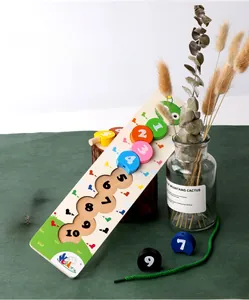 Macro view of wooden caterpillar counting toy with numbered blocks and threading string