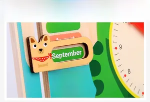 Detail of wooden calendar clock showing monthly slider with cute shiba inu marker