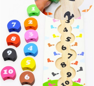 Detail of wooden number matching puzzle with colorful blocks and curved tracking board
