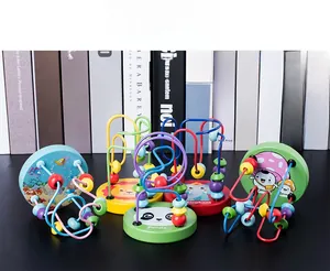 Detailed close-up of five mini wooden bead maze toys with diverse cartoon animal designs