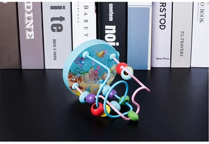 Close-up of mini cartoon ocean bead maze with colorful wooden beads on wire tracks
