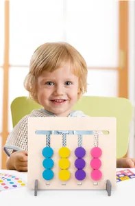 Close-up of wooden Montessori logic game with colorful sliding pieces and pattern cards