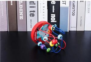 Detail of red wooden base with blue elephant print and colorful beads on metal tracks