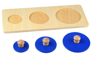 Macro view of Montessori wooden peg puzzle with three blue circles and round grips