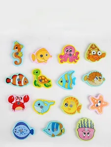 Flat lay of 15 colorful magnetic sea animal toys for early childhood learning and play