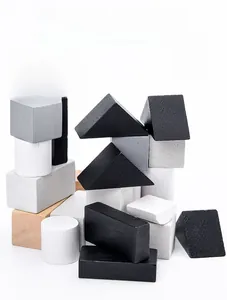 Macro shot of geometric wooden blocks in black, white and natural tones with smooth edges