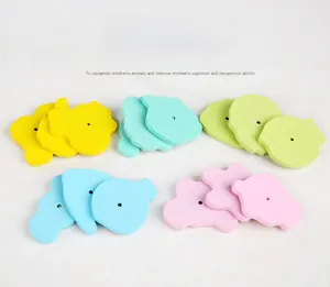 Detail of colorful wooden magnetic fishing puzzle pieces in five pastel macaron colors