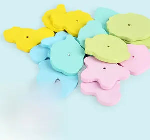 Detail of colorful wooden beads in cloud and flower shapes with smooth water-painted finish