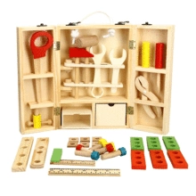 Macro view of wooden toy tool kit with saw, hammer, and colorful building blocks