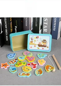 Close-up of magnetic wooden fish pieces and tin storage box for educational play
