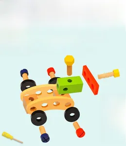 Detail of wooden tool set showing eco-friendly colorful screws and yellow wrench for kids