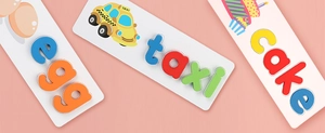 Educational wood letter puzzle showing taxi and cake tiles for kids spelling