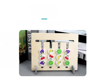 Close-up of wooden Montessori fruit sliding logic game with cherry and banana patterns
