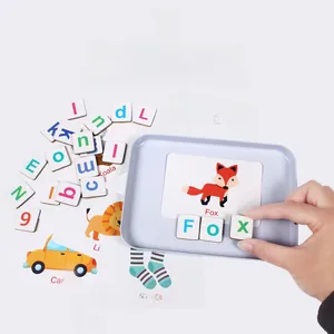 Close-up of children's magnetic letter blocks and word cards for spelling practice