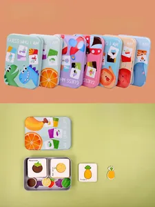 Close-up of educational matching puzzle cards and fruit theme metal storage box