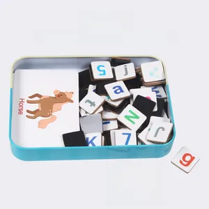 Close-up of magnetic alphabet learning tiles and animal flashcards in a blue tin box