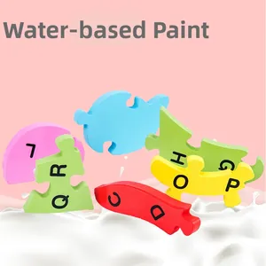 Detail of wooden alphabet puzzles for kids featuring water-based paint and vibrant colors