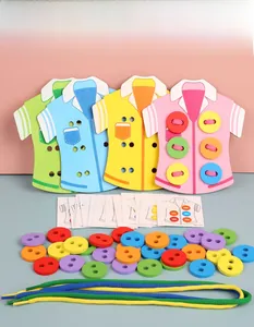 Close-up of wooden shirt boards, colorful buttons, and laces for fine motor skill training